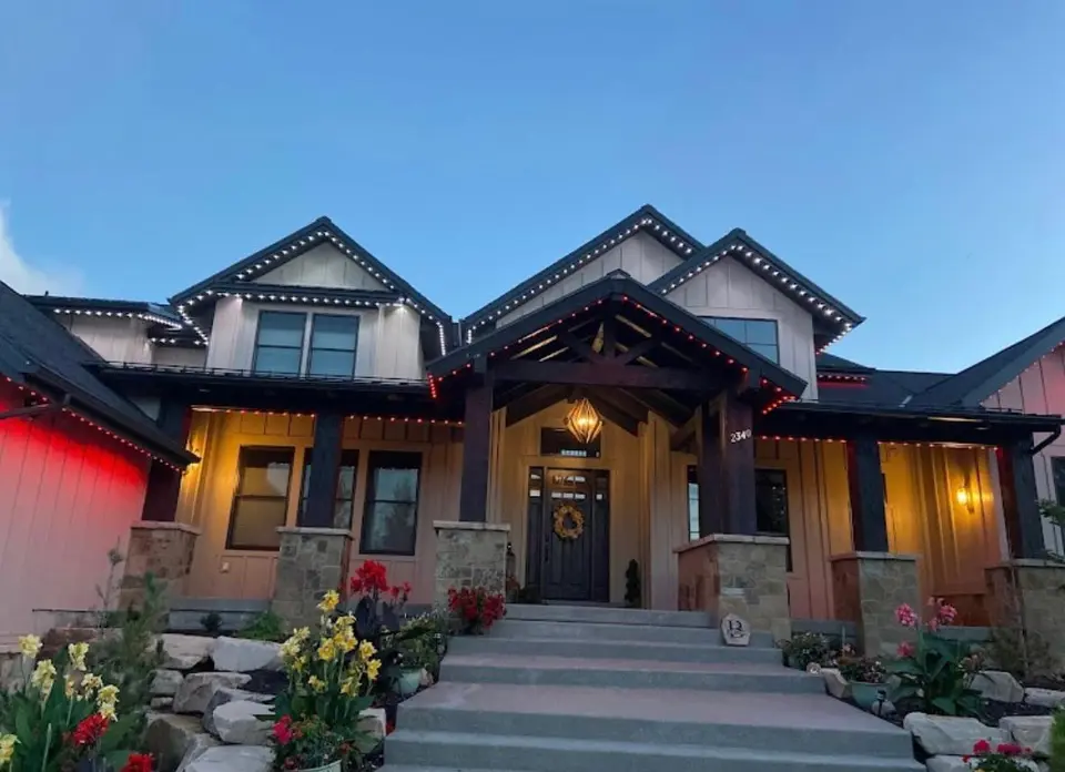 Permanent LED event lighting with gradient colour transition on Calgary home